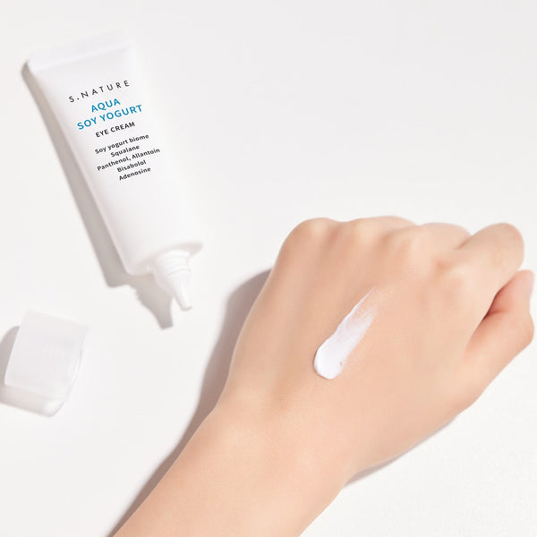 Nourishing under-eye cream in a sleek tube, designed to hydrate, reduce puffiness, brighten dark circles, and minimize fine lines, perfect for delicate and sensitive skin.